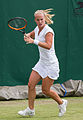 Richèl Hogenkamp competing in the first round of the 2015 Wimbledon Qualifying Tournament at the Bank of England Sports Grounds in Roehampton, England. The winners of three rounds of competition qualify for the main draw of Wimbledon the following week.