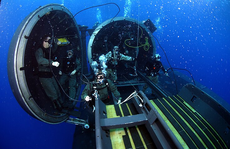 Navy divers and special operators attached to SEAL Delivery Team 2, perform SDV operations with the USS Florida