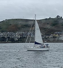 Sailboat with the cove in background Sailboat and Brickyard.jpg