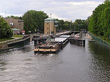 A barge tow passing through Spandau Lock