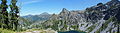 Panorama of the Siskiyou Mountains from a ridge above the western shore of the Devils Punchbowl tarn in the Siskiyou Wilderness in California