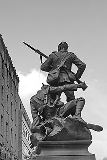 A regimental South African War Memorial (the work of William Hamo Thornycroft) in St Ann's Square, Manchester South African War Memorial, St Anns Square (2513411186).jpg