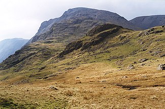 View over Spout Head with the source of Spouthead Gill in the center right and Great Gable in the background
