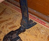 A "carpet gripper" tack strip, for a fitted carpet Tack strip removal technique (7682180480).jpg