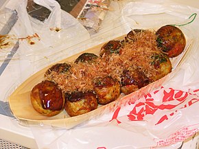 Takoyaki is a ball-shaped Japanese snack made of a wheat flour-based batter and typically filled with minced or diced octopus.