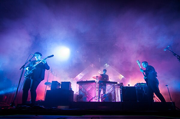 The xx performing at Ilosaarirock Festival in Joensuu, Finland, in 2012. From left to right: Romy Madley Croft, Jamie xx, and Oliver Sim.