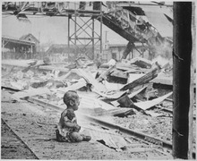 This terrified baby was almost the only human being left alive in Shanghai's South Station after brutal Japanese... - NARA - 535557.tif