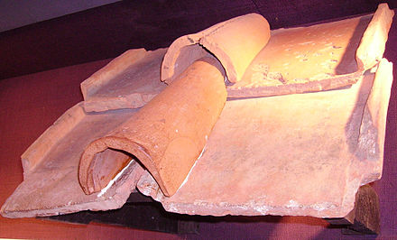 Example of imbrex and tegula flanged roof tiles that were used in "Cappuccina" roofed pit graves. The curved tile is the imbrex