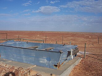 Tirarai Desert from Southern edge bank of Cooper Creek on Birdsville Track showing old punt for crossing during flood TirariCooperCrossing.JPG