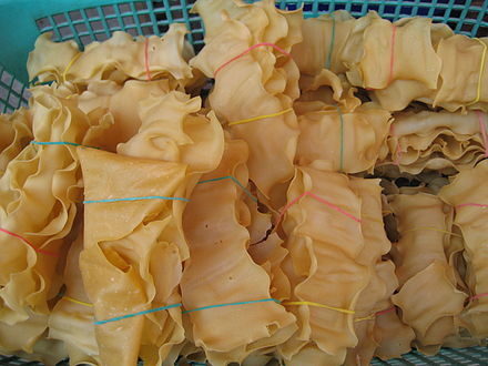 To hpu gyauk (Burmese tofu crackers) are sold in bundles  ready for deep frying.