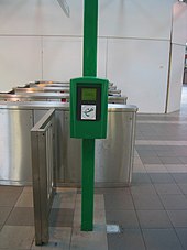 SmartRider tag machine and fare gates behind at Perth station. Transperth SmartRider Processor Perth Train Station.jpg