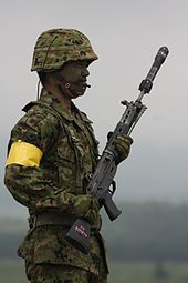 Japanese Type 06 rifle grenade attached to the barrel of a Howa Type 89 assault rifle Type 06 rifle grenade.jpg