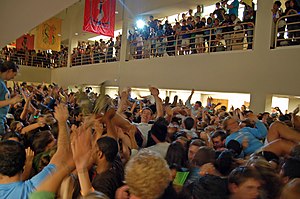 A large gathering of people in a room.