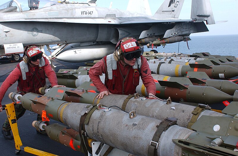 File:US Navy 020303-N-1587C-056 Loading bombs on aircraft aboard ship.jpg