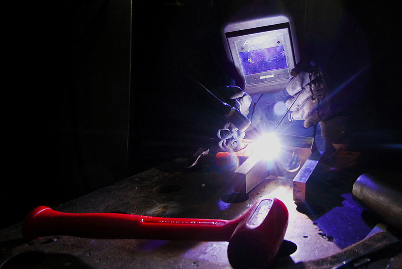 File:US Navy 080205-N-9760Z-004 Hull Maintenance Technician 2nd Class Russell Roemer welds a machine part in the repair shop aboard the aircraft carrier USS Nimitz (CVN 68).jpg