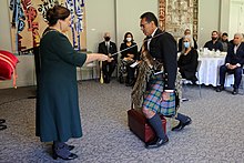 Shelford's investiture as a Knight Companion of the New Zealand Order of Merit by the governor-general, Dame Cindy Kiro, at Government House, Auckland, on 28 May 2022 Wayne Shelford KNZM investiture.jpg