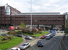 The infamous "Bridge to Nowhere" is now furbished with an office block. Only the part directly over the road constituted the original bridge. Wfm m8 bridge to nowhere.jpg