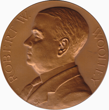 Mint Director Robert W. Woolley (seen on his Mint medal, designed by Assistant Engraver George T. Morgan) advocated for the end of the Barber coinage, though he may not have understood he did not have to replace them. Woolley medal.png