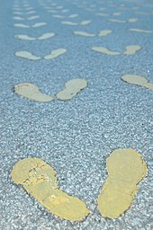 The first activity of a new recruit is to stand in his or her first formation, marked by these yellow footprints Yellow Footprints.jpg