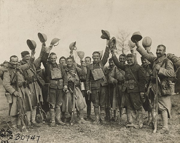 American and French soldiers at the front. The Americans (who during the war were given the nickname of doughboys) are Private John J. Burke, Corporal