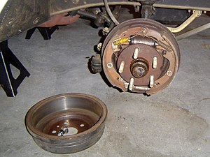 Drum brake (upper right) with the drum removed (lower left, inside facing up), on the front of a Ford Falcon Sprint 1963 1/2 Ford Falcon Sprint Front Drum 02.jpg