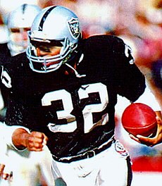 Raiders' Hall of Famer Marcus Allen is considered one of the greatest goal line and short-yard runners in National Football League history. 1985 Police Raiders-Rams - 01 Marcus Allen (crop).jpg