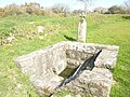 La fontaine de dévotion et une stèle de l'âge du fer christianisée dans l'enclos paroissial de Saint-Ourzal 4.