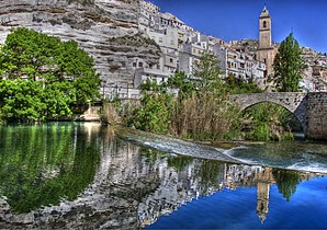 Alcalá del Júcar - View of town with bridge (Puente Romano) over the Río Júcar and church (Iglesia de San Andrés)