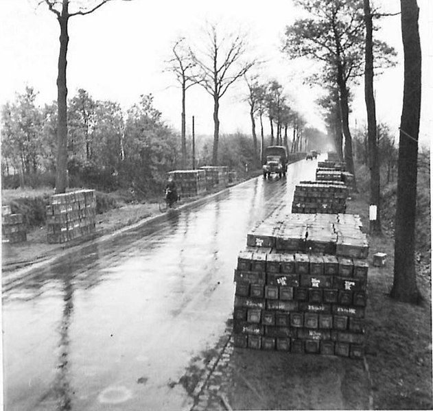 File:Ammunition piled up alongside the road from where they are collected by Units.jpg