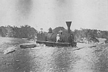 The locomotive "Ballarat" in the sand at Wonnerup, 1921. Reputed to be the oldest in Western Australia, the engine now sits in St Marys Park, Busselton. BallaratLocomotive WEFretwellCollection.jpg