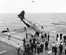 An FM-2 Wildcat upended on USS Sable during a training flight May 1945