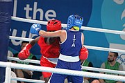 Deutsch: Boxen bei den Olympischen Jugendspielen 2018 Tag 12, 18. Oktober 2018 - Finale Fliegengewicht Mädchen – Martina La Piana (Italien, blau) schlägt Adijat Gbadamosi (Nigeria, rot) 5-0; Ringrichter ist James Beckles (Trinidad und Tobago). English: Boxing at the 2018 Summer Youth Olympics on 18 October 2018 – Girl's flyweight Gold Medal Bout - Martina La Piana (Italy, blue) beats Adijat Gbadamosi (Nigeria, red) 5-0; Referee is James Beckles (Trinidad and Tobago). Español: Boxeo en los Juegos Olímpicos Juveniles de Verano de 2018 en 18 de octubre de 2018 - Combate a medalla de oro de peso mosca para mujeres: Martina La Piana (Italia, azul) le gana a Adijat Gbadamosi (Nigeria, roja) 5-0; El árbitro es James Beckles (Trinidad y Tobago).