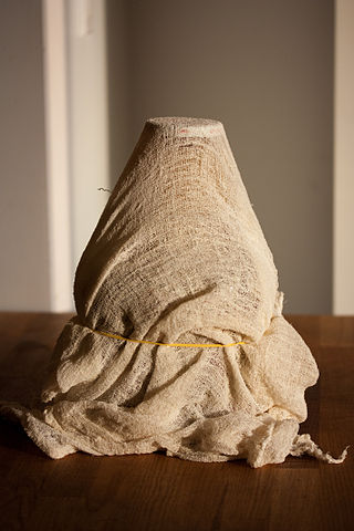 <span class="mw-page-title-main">Cheesecloth</span> Loosely woven carded cotton cloth used primarily in cooking and cheesemaking