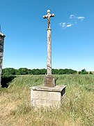 Cette croix située à Corseul dans les Côtes d’Armor, datant de 1895, est l’œuvre de l’atelier Yves Hernot à Lannion. Déplacée au XXe siècle, elle se trouve près de la chapelle Sainte-Eugénie.