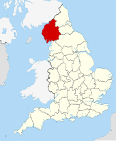 The modern-day county boundaries of Cumbria (red) within England; Meschin held lands within this area. Cumbria UK locator map 2010.svg