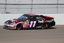 The FedEx-sponsored No. 11 car at the 2012 Kobalt Tools 400, driven by Denny Hamlin Denny Hamlin at the 2012 Kobalt Tools 400 in Las Vegas.jpg