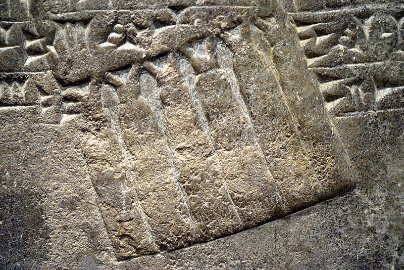 File:Detail. Tassels, part of the attire of one of Ashurnasirpal II's attendants. The Standard Inscription of Ashirnasirpal II appears. Bas-relief from the North-West Palace at Nimrud, Iraq. 9th century BCE. National Museum of Scotland.jpg