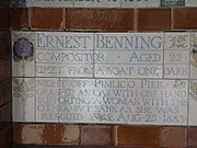 A tablet formed of five tiles of varying sizes, bordered by yellow and blue flowers in an art nouveau style