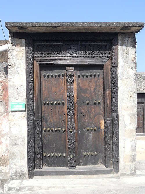 Swahili Arabic script on wooden door in Fort Jesus, Mombasa in Kenya