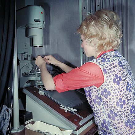 Quality inspector in a Volkseigener Betrieb sewing machine parts factory in Dresden, East Germany, 1977