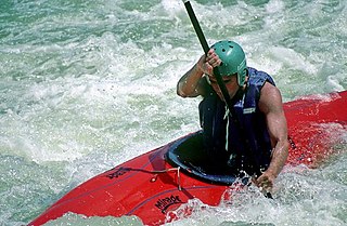 Kayak small boat propelled with a double-bladed paddle