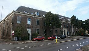 Many government-owned buildings are national heritage sites, such as the local police headquarters located on the Koudenhorn 2. Originally built as the Dutch Reformed Diaconie (poor house and orphanage) in 1768, it was built to house up to 900 people, indicating the extent of the economic crisis in Haarlem that had resulted from losing shipping power to Amsterdam.