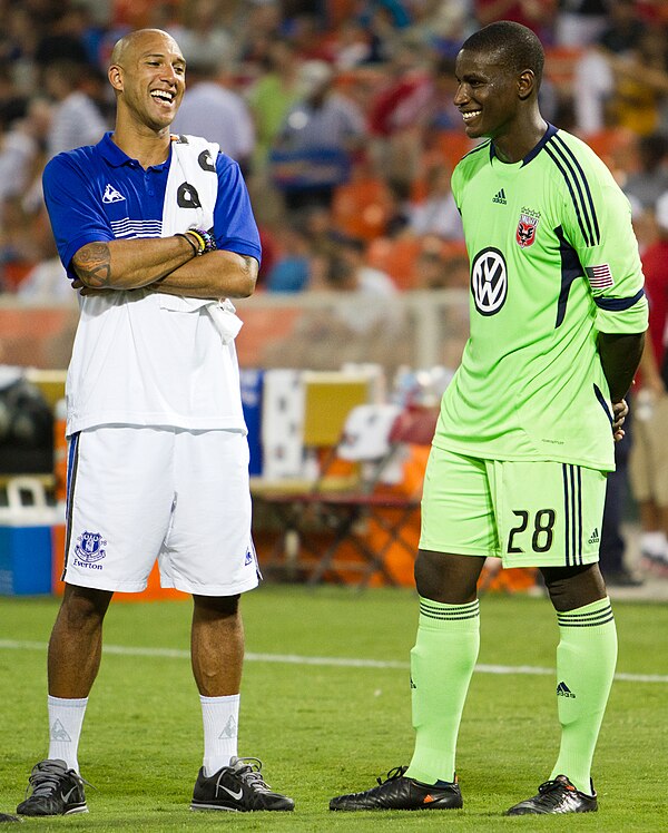 Hamid speaks with Everton and USMNT goalkeeper Tim Howard before a friendly match on July 23, 2011, at RFK Stadium