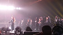 Jackson and her dancers performing "All Nite (Don't Stop)" during her Unbreakable World Tour (2015-16). JanetJacksonUnbreak 1826 (22777897299).jpg