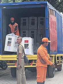 Workers unloading ballot boxes in Jakarta the day before the election. KPU Workers Unloading Ballot Boxes Indonesia 2024.jpg