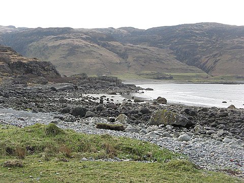Laggan Sands at Lochbuie has a sandy beach behind a storm beach of boulders.