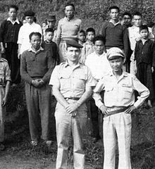 PEO adviser Jack F. Mathews with then Major Vang Pao, commander of the 10eme Bataillon de Infanterie (10 BI), at Nong Net, Laos, July 1960 LaosTraining.jpg