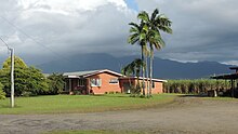 Homestead among the cane fields, 2018 Looking north-west from Buckland Road towards farm house and distant mountains, Mirriwinni, 2018.jpg