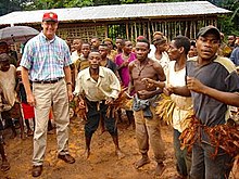 Baka dancers greet the U.S. ambassador to Cameroon in the East Province. Marquardt & Baka dancers.jpg