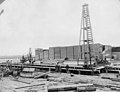 Men working on dock stacked with lumber, Bloedel-Donovan Lumber Mills, ca 1922-1923 (INDOCC 1116).jpg